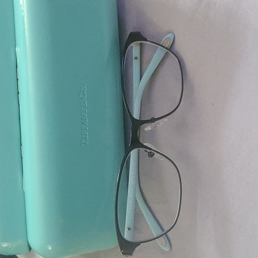 Tiffany and company frames.   Aqua marine and black . Carrying case includes